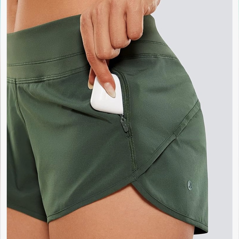 Women’s hunter green athletic shorts with zip pocket, size M and NWOT